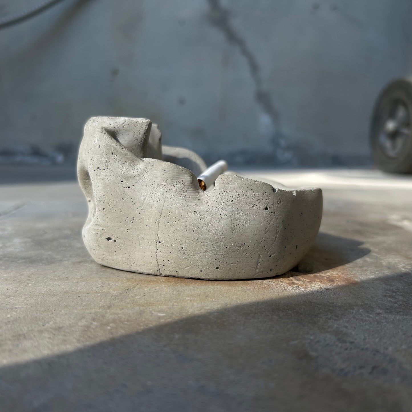 Raw concrete skull ashtray