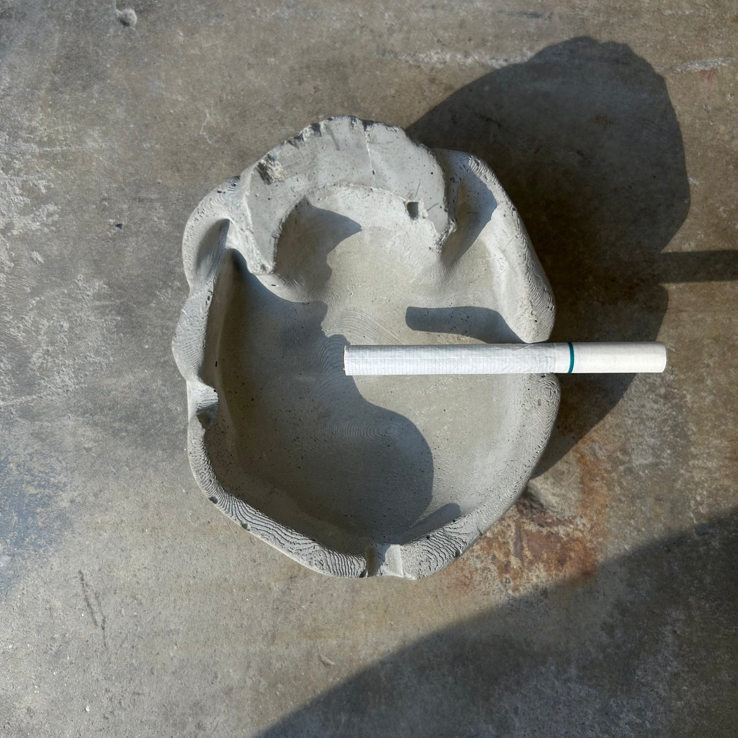Raw concrete skull ashtray