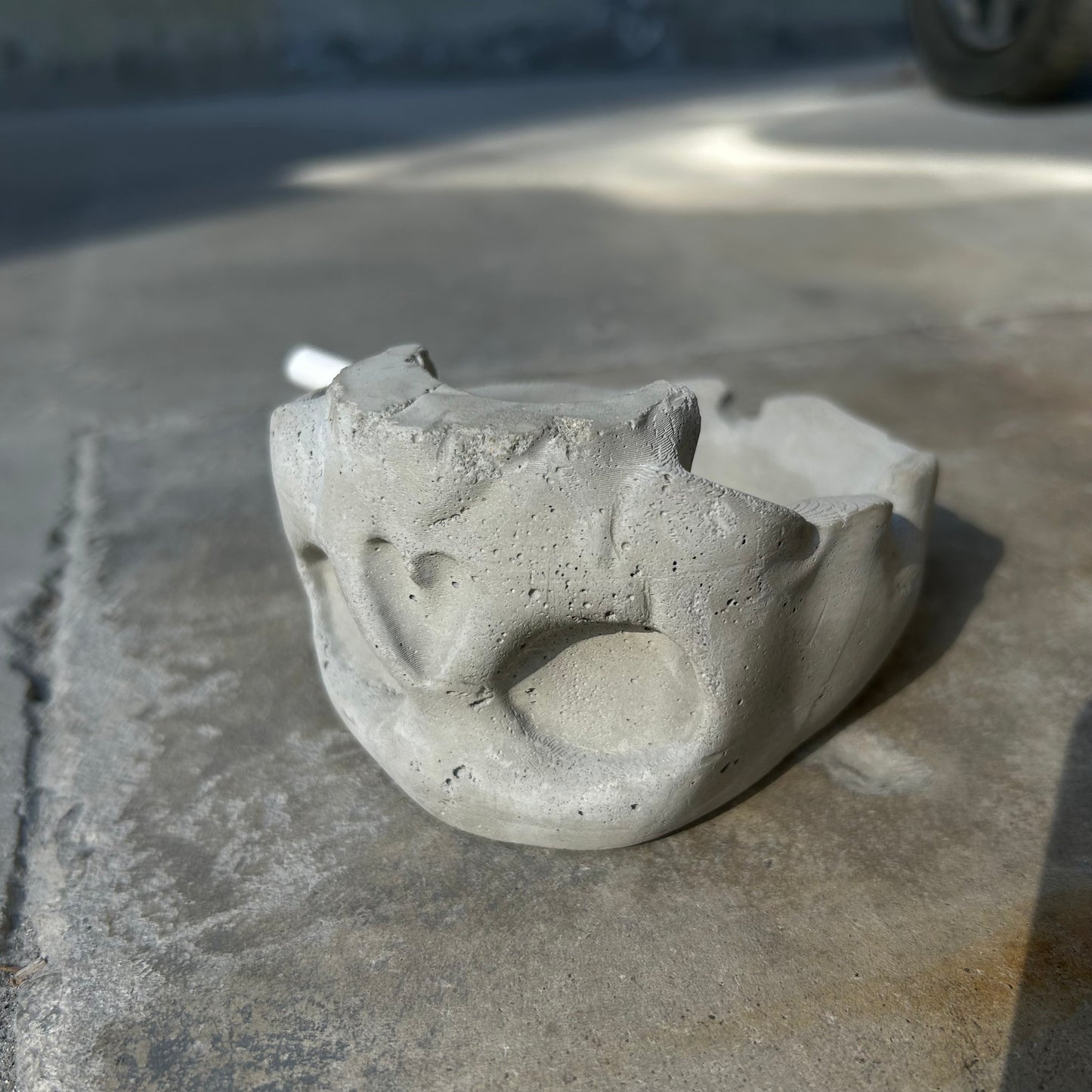Raw concrete skull ashtray