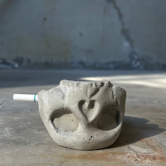 Raw concrete skull ashtray